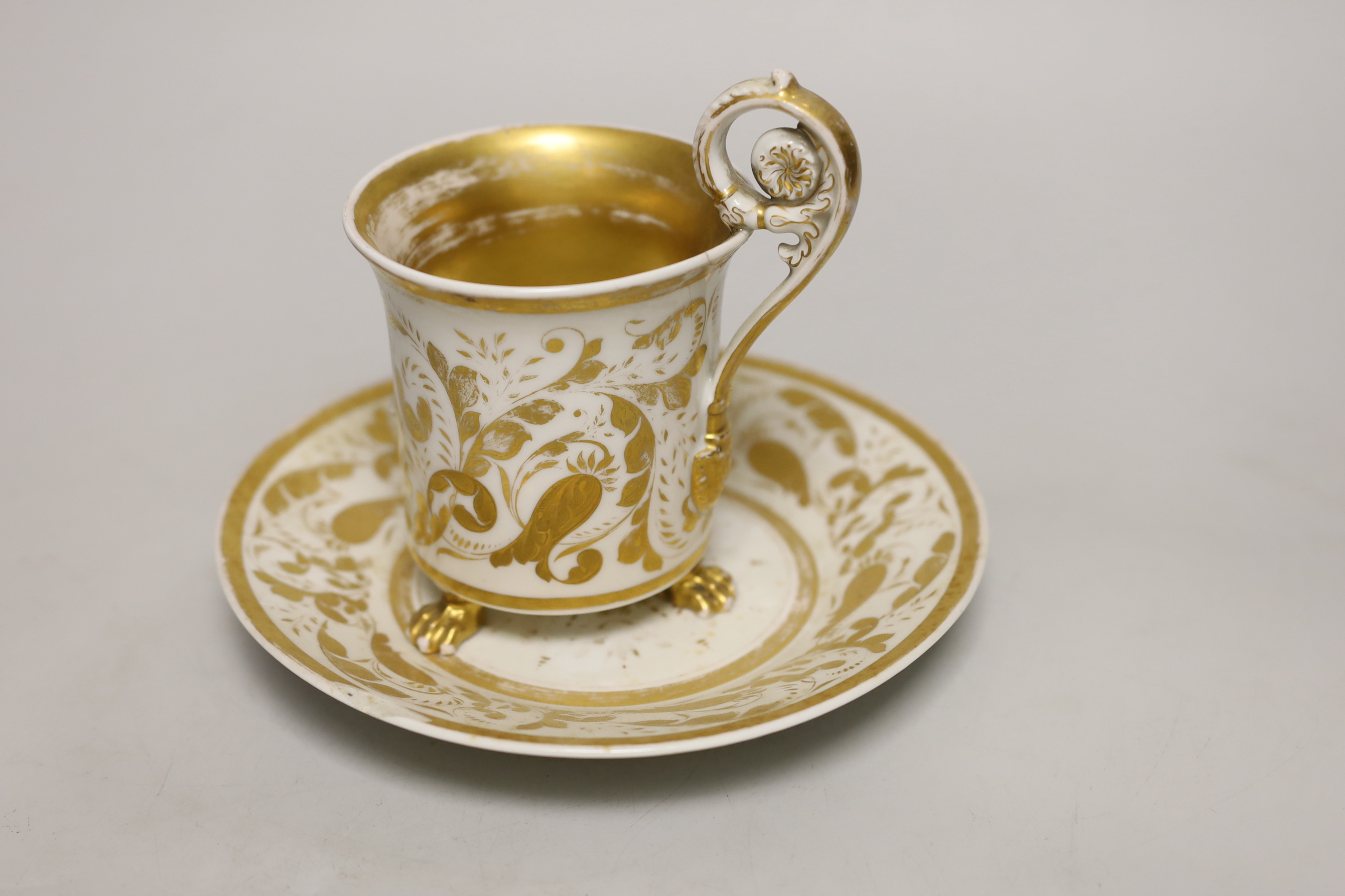 A Berlin porcelain cameo portrait cup and saucer, first half 19th century, cup 13cm to top of handle